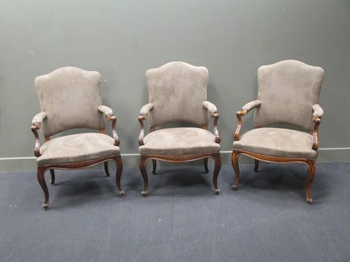 Lot 412 - A set of three taupe suede and brass buttoned...