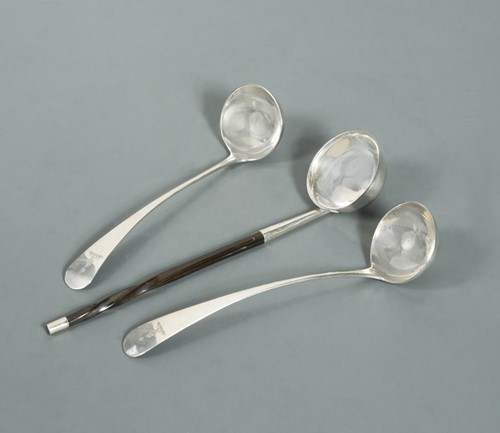 Lot 628 - Edinburgh - A pair of George III silver toddy ladles and another