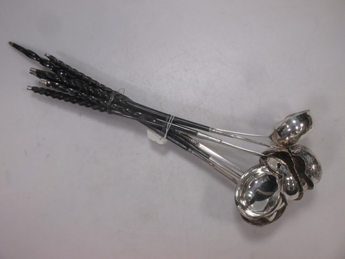 Lot 164 - Seven punch ladles, each with a pouring lip (7)