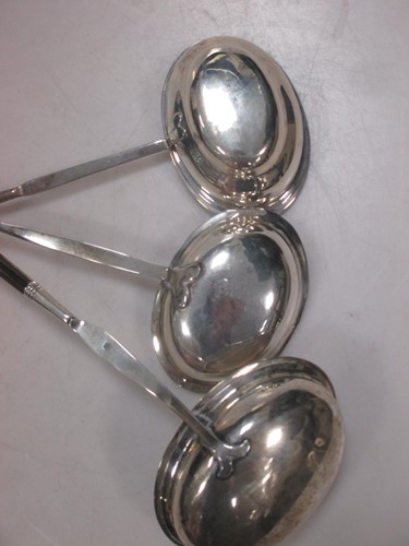 Lot 163 - Three punch ladles, each with oval bowls, max...