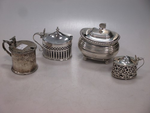 Lot 165 - Four silver mustard pots, two with blue glass...