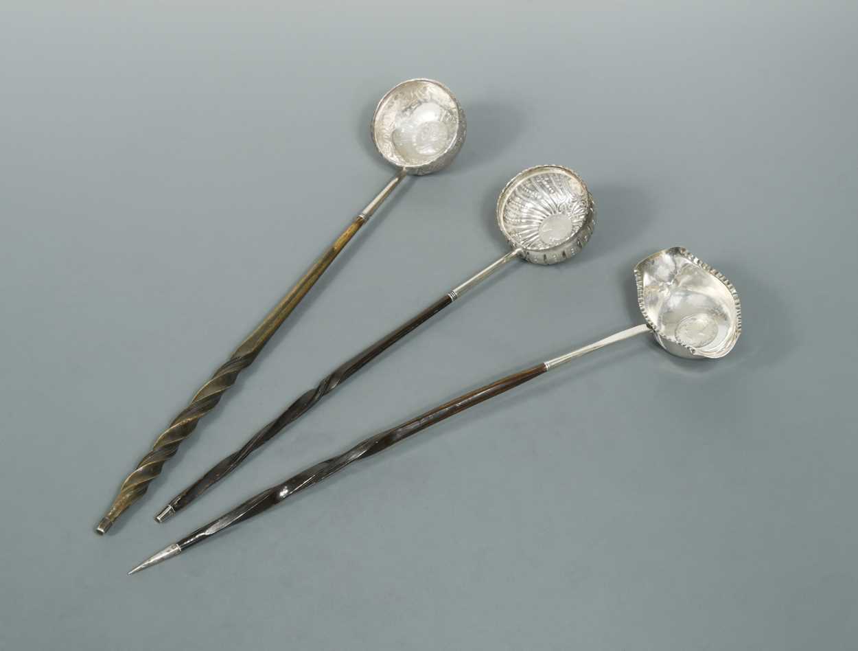 Lot 431 - Three punch ladles each set with a Queen Anne coin