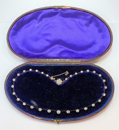Lot 199 - A Victorian diamond set rivière necklace