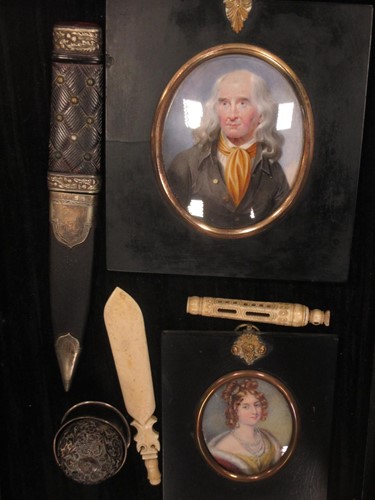 Lot 107 - Two portrait miniatures in typical black...