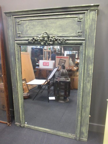 Lot 409 - A French green painted wall mirror of large...