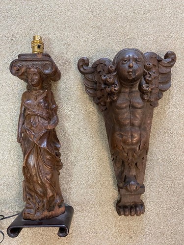 Lot 459 - An oak cherubic tapering wall bracket, 17th century