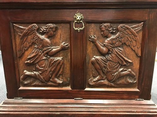 Lot 463 - A pair of carved oak panels of kneeling angels