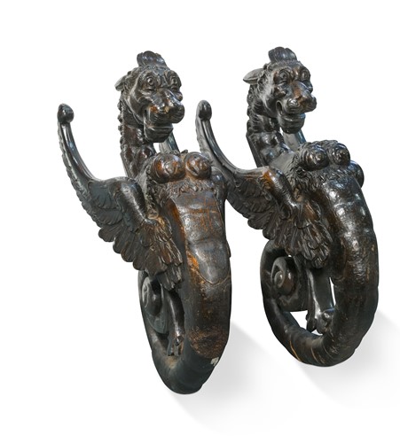 Lot 449 - A pair of late 16th or early 17th century carved gryphon-type mounts