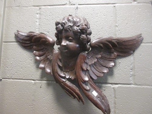 Lot 77 - A carved oak cherub head, 18th or 19th century,...