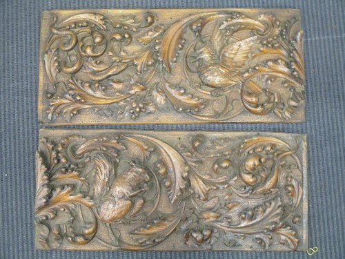Lot 48 - A pair of carved oak panels, decorated with a...