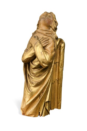Lot 496 - A carved and gilded pine angel, probably 18th century