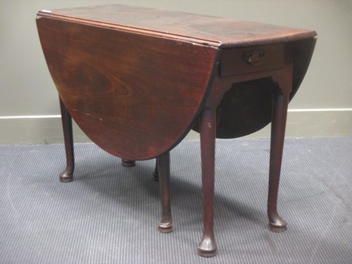 Lot 434 - An 18th Century walnut drop-leaf dining table,...