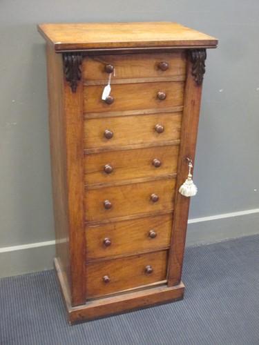 Lot 361 - A Victorian walnut seven draw Wellington chest...