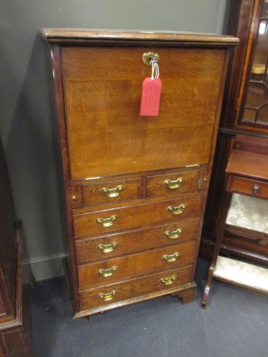 Lot 420 - An early 20th century oak escritoire 126 x 63...