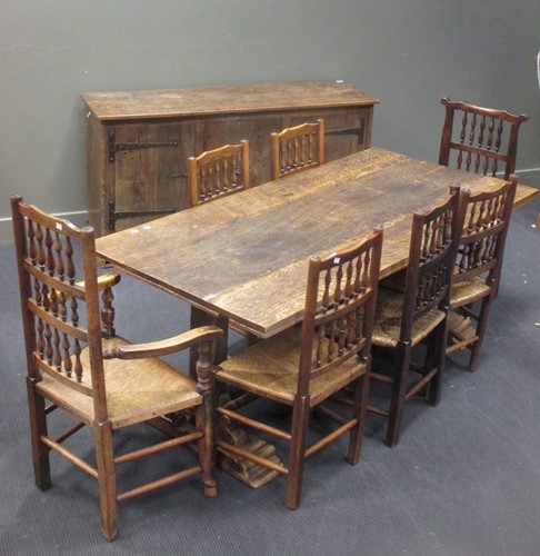 Lot 456 - An 18th century style oak trestle dining table...