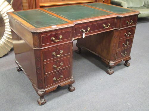 Lot 521 - A Georgian style mahogany desk on ball and...
