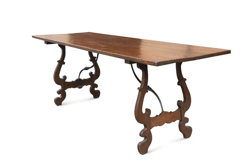Lot 467 - An Italian trestle dining table with wrought iron supports