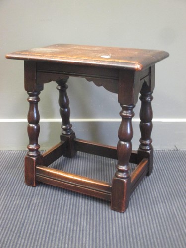 Lot 460 - An oak joint stool