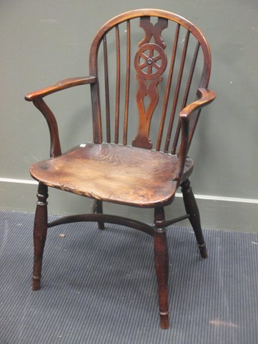 Lot 435 - A 19th century yew wood and elm Windsor armchair