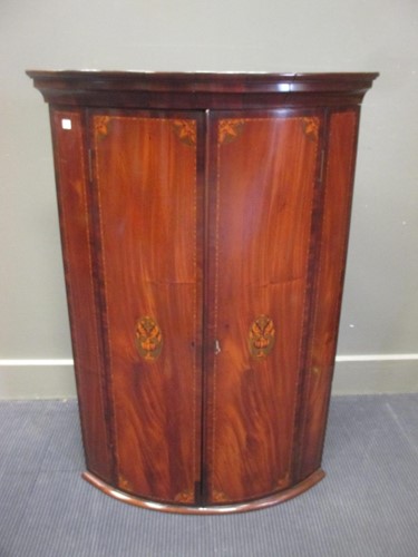 Lot 366 - George III inlaid mahogany bow front corner...