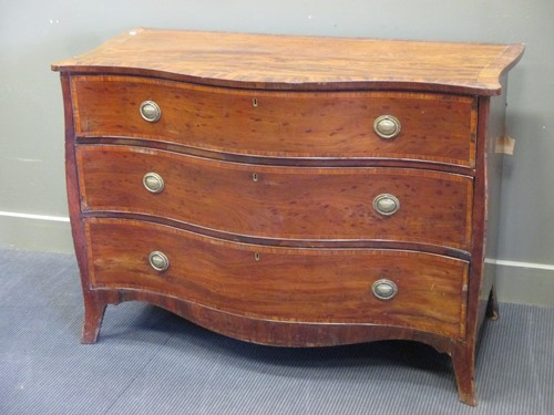 Lot 334 - George III mahogany serpentine chest of...