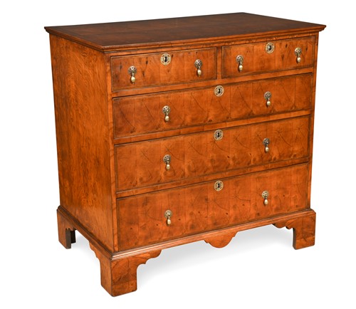 Lot 567 - An oyster veneered chest of two short and three long drawers, early 18th century style