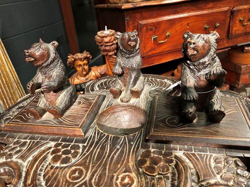 Lot 590 - A Black Forest carved bear smoker's stand