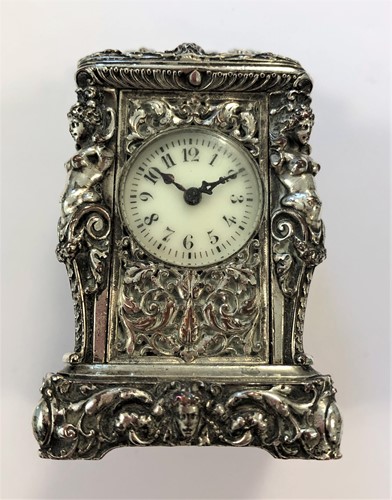 Lot 388 - Aiguiller - A silver plated miniature carriage clock with original travelling case