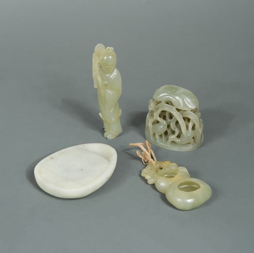 Lot 140 - A group of four Chinese jade items: Qing Dynasty and later