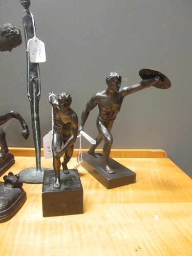 Lot 58 - Two bronzed models of discus throwers,...