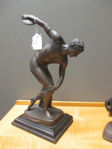 Lot 58 - Two bronzed models of discus throwers,...