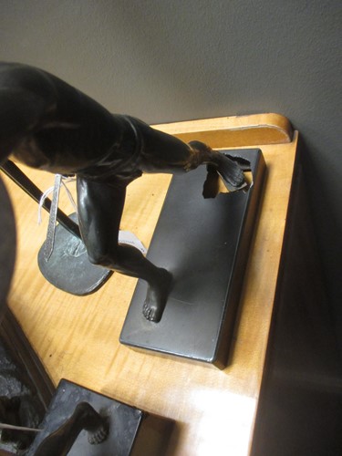 Lot 58 - Two bronzed models of discus throwers,...