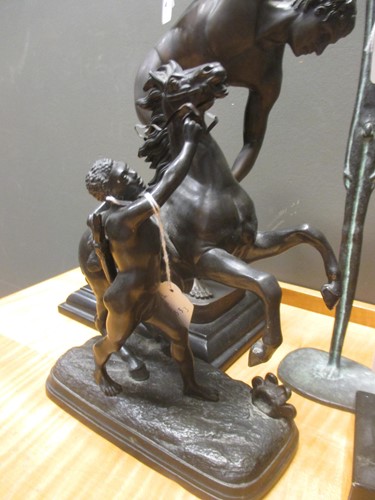Lot 58 - Two bronzed models of discus throwers,...