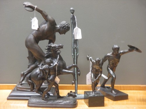 Lot 58 - Two bronzed models of discus throwers,...