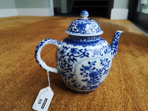 Lot 69 - A Chinese blue and white porcelain teapot and cover, Qianlong seal mark but later