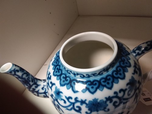 Lot 69 - A Chinese blue and white porcelain teapot and cover, Qianlong seal mark but later