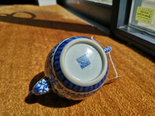 Lot 69 - A Chinese blue and white porcelain teapot and cover, Qianlong seal mark but later