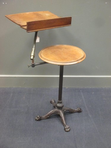 Lot 439 - A Victorian adjustable reading table on a cast...