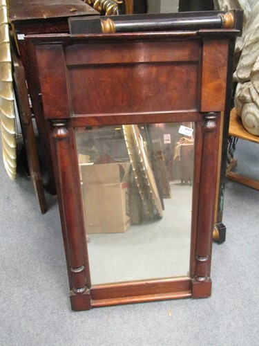 Lot 522 - A Columnar framed black and gold overmantel...
