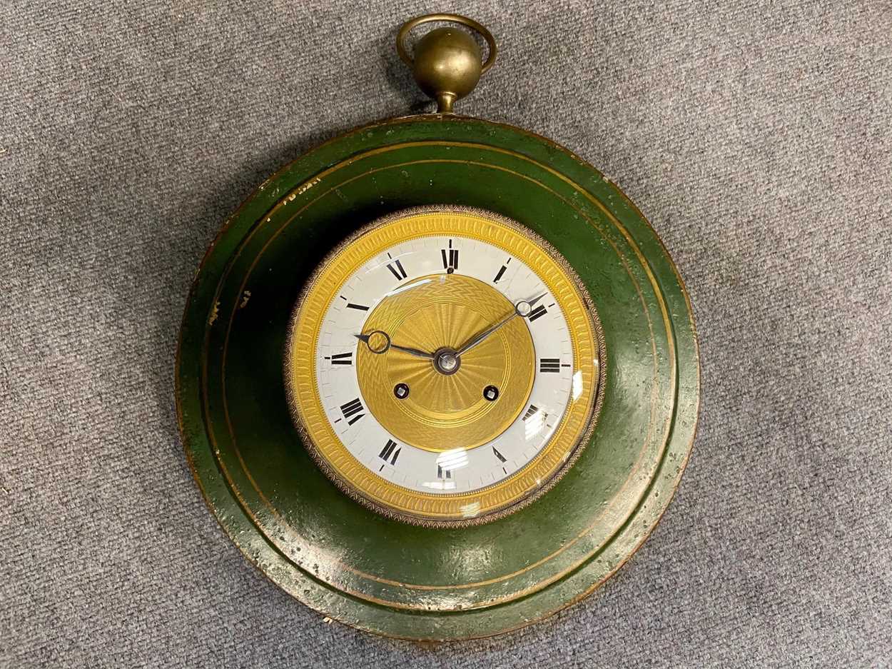 Lot 429 - A French 19th century circular tole case wall clock