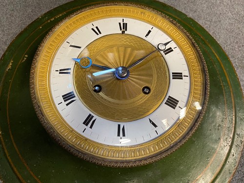 Lot 429 - A French 19th century circular tole case wall clock