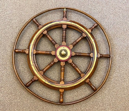 Lot 415 - A late 19th or early 20th century ash ship's wheel