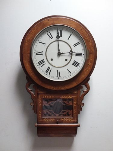 Lot 29 - A late Victorian American walnut case drop dial wall clock