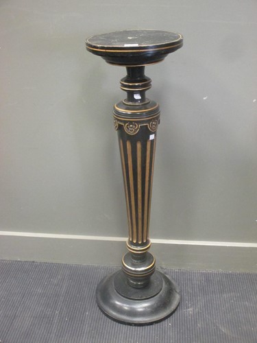 Lot 392 - An ebonised and parcel gilt pedestal with...