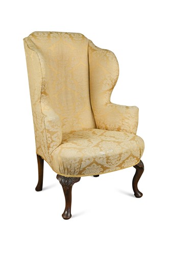 Lot 565 - A Queen Anne style wing armchair, late 19th century