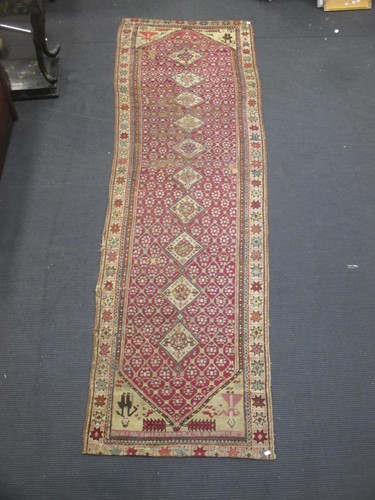 Lot 542 - A late 19th century Kurdish runner