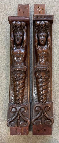 Lot 443 - A pair of 17th century carved oak herms