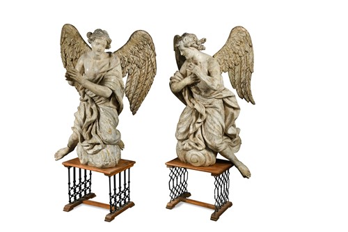 Lot 465 - A large and imposing pair of carved and painted angels, probably late 17th century