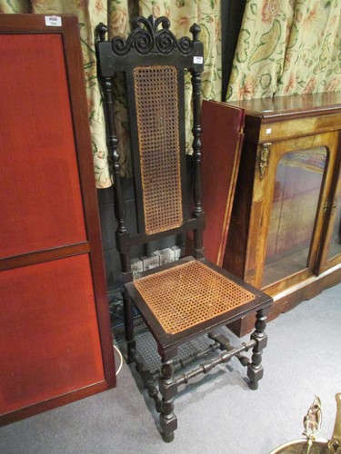 Lot 529 - An oak high back chair