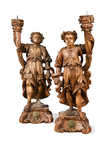 Lot 476 - A pair of Continental carved limewood pricket stands, 17th century